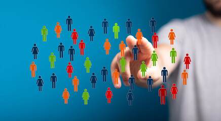 Hand pointing at colorful people icons representing digital communication, network and global connectivity concepts.