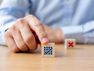 Hand selecting wooden block with check mark symbol decision making choice
