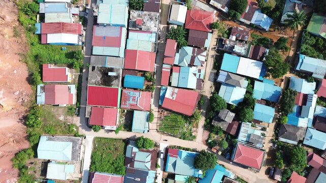 Panoramic Overhead View of a Bustling Village Community Featuring Multicolored Rooftops and
