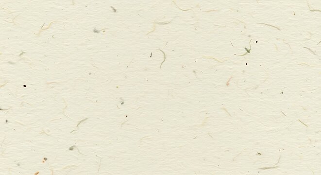 Close up of textured handmade paper with visible fibers and specks