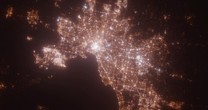 Melbourne (Australia) aerial view at night. Top view on city from space. Camera is zooming in, rotating clockwise