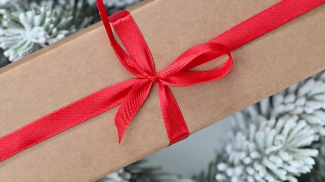 video of a gift with a red ribbon and bow