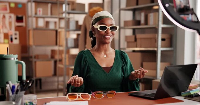Woman, unboxing and ring light with sunglasses, talk and happy with choice for online audience. African girl, dropshipping and influencer with affiliate marketing, fashion or social media with tech