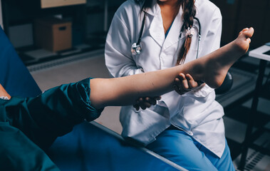 Rehabilitation therapy Professional male physiotherapists working in rehabilitation centers while...