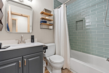 This is a bathroom that includes a toilet, a sink, a shower and a bathtub