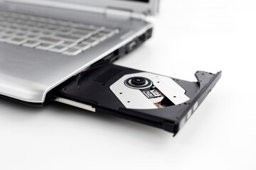 Laptop with open CD DVD drive, Closeup image isolated on a white background