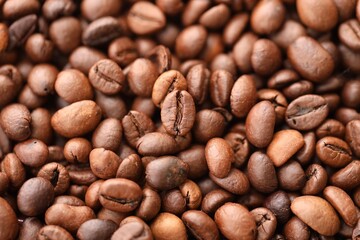 Coffee texture roasted beans from above soft light close up