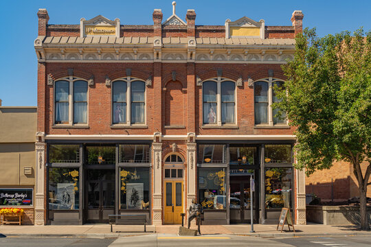 Pendleton, OR, US- August 12, 2025: Street scene in downtown of this small town with its quaint streets with 19th century brick buildings and trendy shops and restaurants.