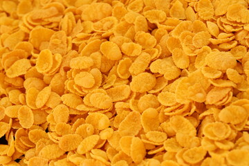Corn flakes background and texture close up. Cornflake cereal box for morning breakfast