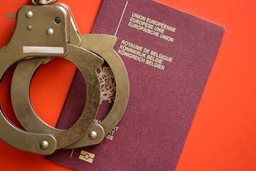 Belgium Passport With Police Handcuffs