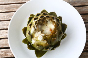 cooked seasonal artichoke with cheese and sobrasada