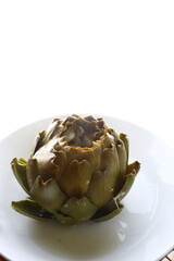 cooked seasonal artichoke with cheese and sobrasada