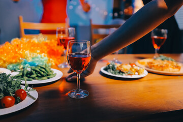 Joyful office Halloween party with coworkers in costumes, celebrating with drinks and laughter, fostering teamwork and festive spirit