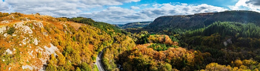 Autumn colours over Gwydir Forest Park from a drone, Afon Lledr, Road A470, Snowdonia, Eryri, Wales, England