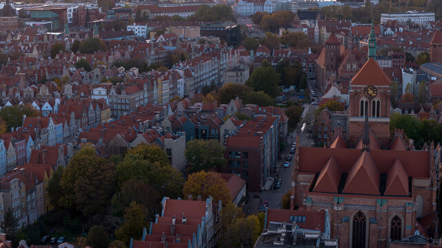 Aerial dusk view of Gdansk Old Town with St Marys Church and port - Powered by Adobe