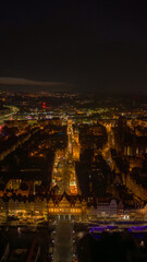Aerial night view of Gdansk Old Town along Dluga Street to Town Hall