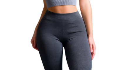 PNG of A female model showcasing stylish activewear in form-fitting gray leggings and a cropped top, perfect for workouts.