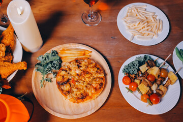 Joyful office Halloween party with coworkers in costumes, celebrating with drinks and laughter, fostering teamwork and festive spirit