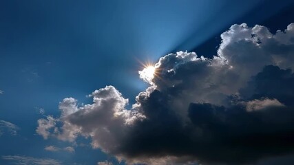 Sunlight bursts from behind a dark cloud casting bright rays across a blue sky with scattered light and dark clouds - Powered by Adobe