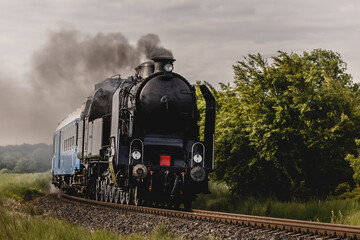 Classic steam locomotive moving. History and power on the rails.