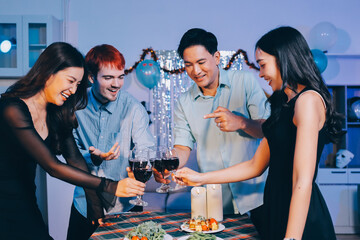 Diversity, dinner and group of people toast celebration together at party. Friends, happy and celebrate with food, wine and friendship for love, support and cheers champagne at business function