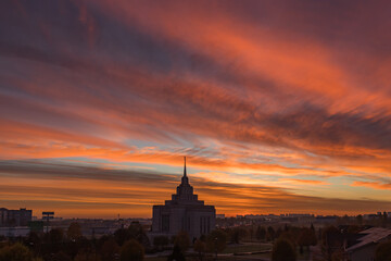 Obraz premium Skyline at sunrise. Colorful dawn. Sky of Ukraine. Mormon Church. European country. Megapolis Kyiv. Panorama of a big city. Sky gradient. Enchanting beauty of nature. Tourism in Europe. 