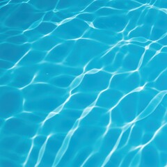 A bright, vibrant blue water surface with subtle shimmering ripples and reflections, indicating clean, refreshing liquid ready for swimming ,summer ,brilliant ,pool