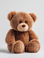 Fototapeta premium Adorable cozy brown teddy bear with dark eyes, perfect for capturing warmth and comfort. This cozy teddy bear can be the ideal subject in your imagery, offering charming appeal and ample copy space.