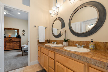 A spacious bathroom that features two sinks alongside two mirrors