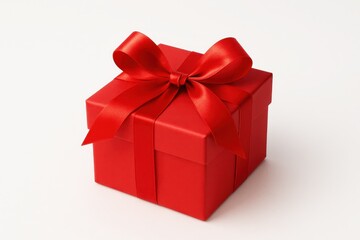 Obraz premium Bright red gift box with satin ribbon bow isolated on white festive product visual photography