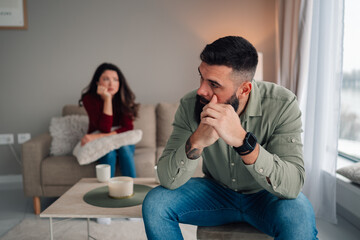 Couple having conflict, feeling sad after argument