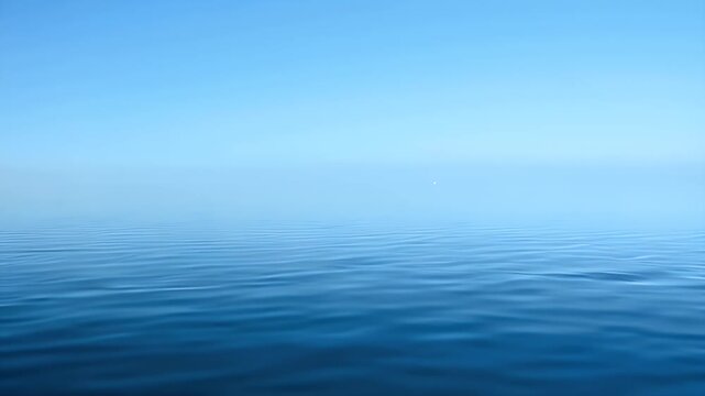 A Vast Open Ocean Horizon Beneath a Clear Bright Blue Sky