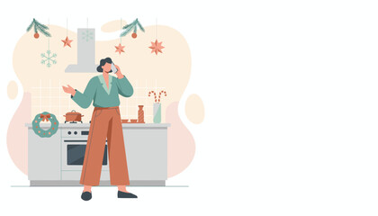 Woman on phone in a Christmas kitchen planning holiday preparations