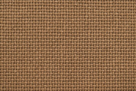 Natural brown cotton fabric weave seamless textile texture with soft tactile depth