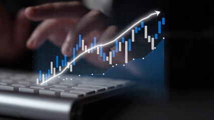 A modern workspace featuring hands typing on a keyboard with an overlay of a financial graph. This image captures the essence of data analysis and market growth. Copula