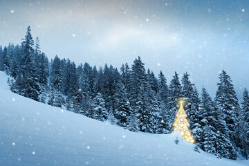 Christmas background with golden fir tree in a winter forest.