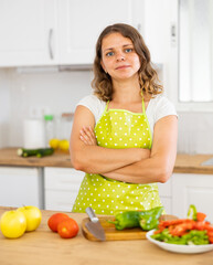 Portrait of young woman food blogger in apron cooking on kitchen