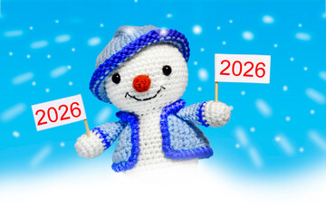 snowman with a sign with the inscription 2026, on a blue background, new year concept