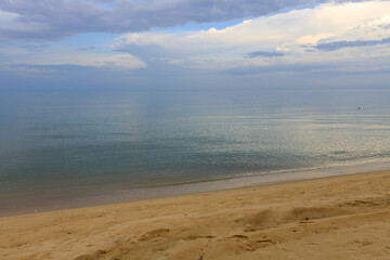 Beach with a cloudy sky in the background
