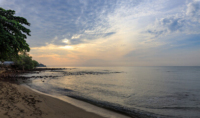 Beautiful beach with a cloudy sky in the background