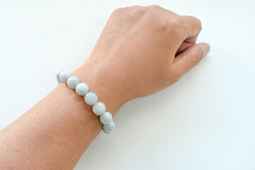Aquamarine bracelet on woman wrist.