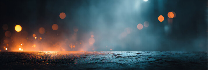 Wet asphalt surface with fog and blurred orange and blue lights in night atmosphere