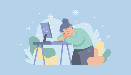 Tired worker sleeping at the desk in winter feeling burnout or seasonal affective disorder SAD