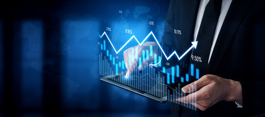 A businessman analyzes a digital growth chart on a tablet, visualizing financial metrics and trends...