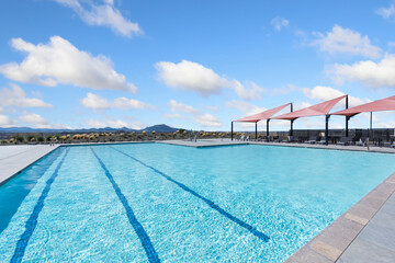 beautiful swimming environment, relaxing swimming venue with scenic hills and shaded lounging zones