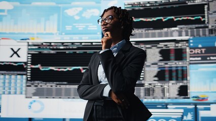 Management executive comparing company metrics on digital videowall before making decisions. Entrepreneur analyzing key performance indicators to optimize startup profitability, camera A