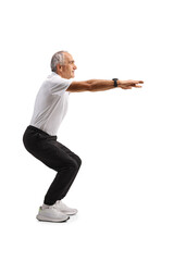 Fit mature man exercising squats