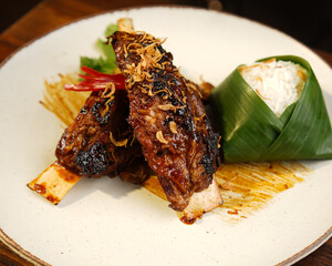 Traditional Indonesian Grilled Chicken with Banana Leaf Rice