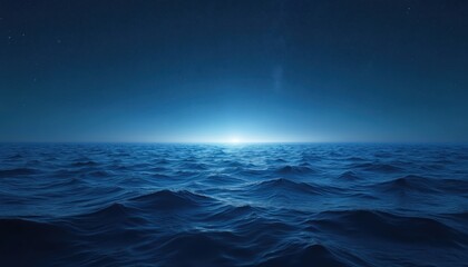 Fototapeta premium Stars glow above deep ocean. Dark blue water and sky meet at horizon. Night scene with starlight. Distant light creates an atmosphere of mystery and beauty. Calm waves.