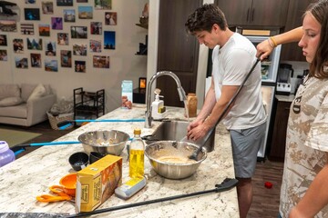 Cooking Together An Enjoyable and Warm Moment Shared in the Kitchen